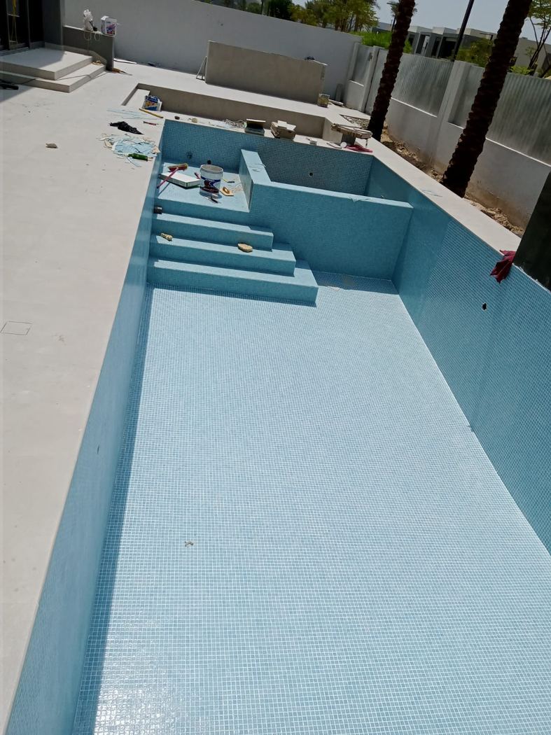 Pool mosaic tiling in progress